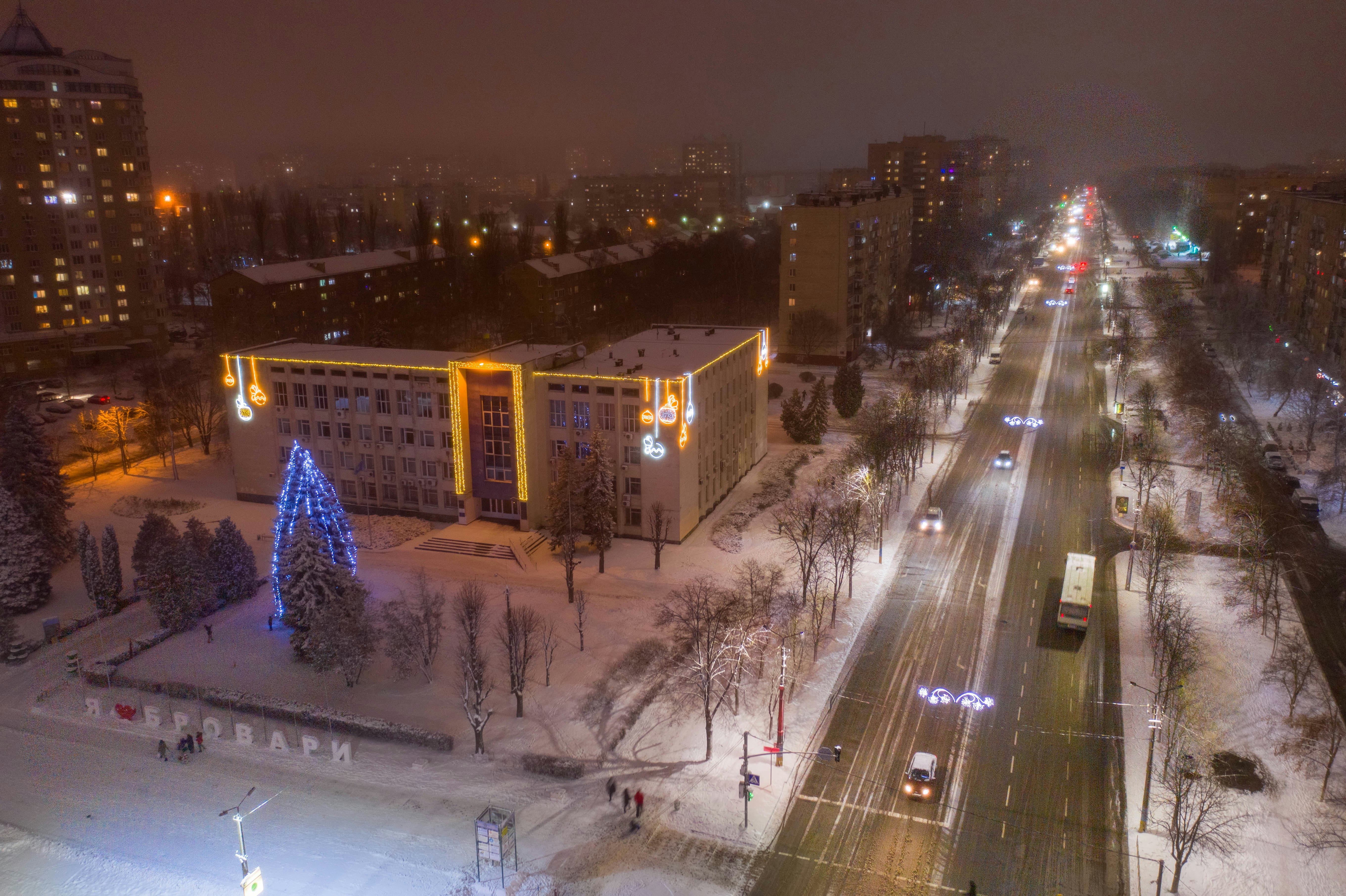 high rise buildings with lights turned on during night time